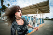 drag queen rocker with big wig playing the guitar