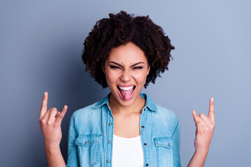 Sticker - Photo of carefree overjoyed person fingers show heavy metal symbol tongue out isolated on grey color background