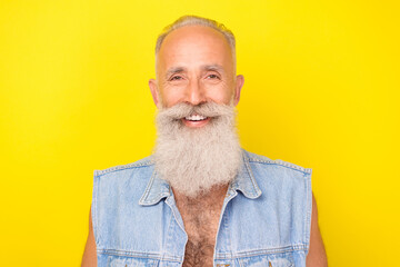 Wall Mural - Photo of funny cheerful man pensioner dressed denim vest smiling white teeth isolated yellow color background