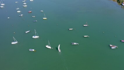 Poster - Sailing Dinghies and small boats anchored in the beautiful Estuary at the sailing location of Bosham in West Sussex England.