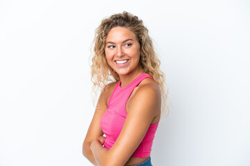 Wall Mural - Girl with curly hair isolated on white background with arms crossed and happy