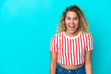 Wall Mural - Girl with curly hair isolated on blue background with surprise facial expression