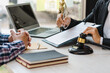 © makibestphoto - Human hands working with documents at the desk closeup