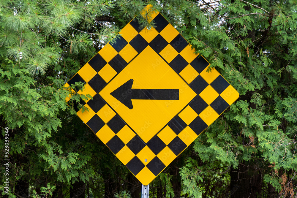 yellow and black checkerboard diamond road caution sign with black ...