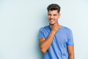 Wall Mural - Young caucasian man isolated on blue background touching back of head, thinking and making a choice.