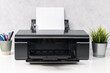Inkjet printer with blank paper sheet on office desk. Template mock up