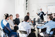 © kasto - Relaxed informal IT business startup company team meeting.