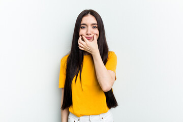 Young caucasian woman isolated on white background doubting between two options.