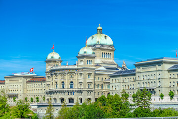 Wall Mural - BERN, SWITZERLAND - August 2nd 2022: View on The Federal Palace of Switzerland (Bundeshaus) from the Kirchenfeld Bridge.