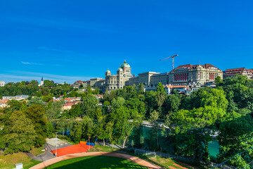 Wall Mural - BERN, SWITZERLAND - August 2nd 2022: View on The Federal Palace of Switzerland (Bundeshaus) from the Kirchenfeld Bridge.