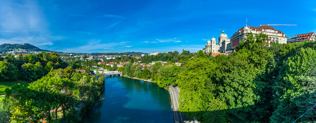 Wall Mural - BERN, SWITZERLAND - August 2nd 2022: River Aare in Bern with the  Federal Palace of Switzerland (Bundeshaus) on right.