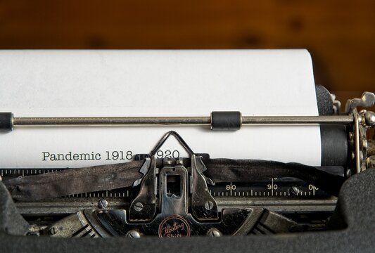 Pandemic 2020  concept with mechanical typewriter printing out ‘Pandemic 1918 - 1920’