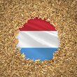 Flag of luxembourg with grains of wheat. Natural whole wheat concept with flag of luxembourg