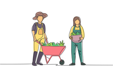 Wall Mural - Single continuous line drawing happy couple farmer with wheelbarow trolley and basket full of fruits. A successful harvest activity minimalism concept. One line draw graphic design vector illustration