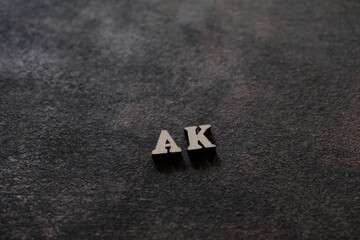 Wall Mural - the letters a and k above the dark field. initials ak