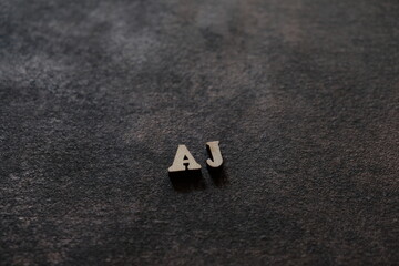 Wall Mural - The letters A and J above the dark field. Initials AJ