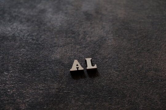 The letters A and L above the dark field. Initials AL