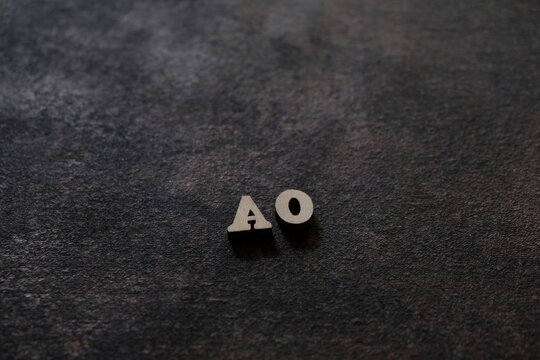 The letters A and O above the dark field. Initials AO