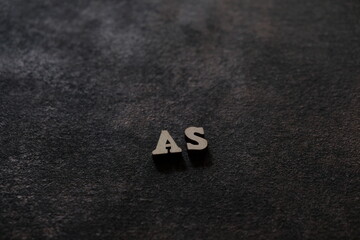 Wall Mural - The letters A and S above the dark field. Initials AS