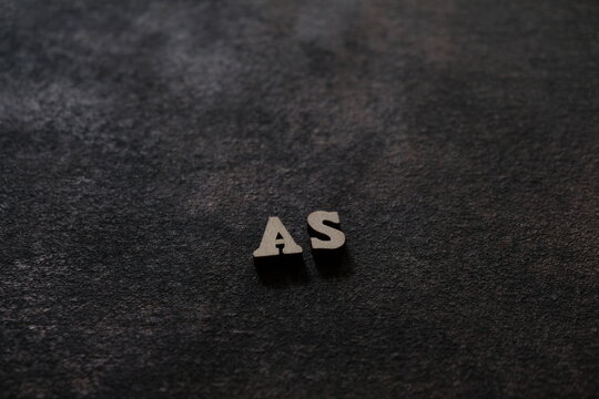 The letters A and S above the dark field. Initials AS