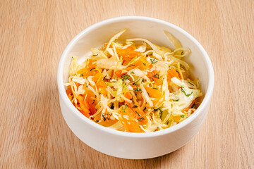 Wall Mural - cabbage salad on the wooden background