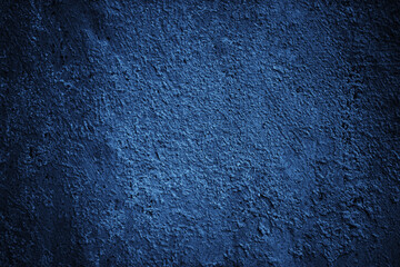 Wall Mural - Dark blue texture. Toned rough wall surface. Background for design. Close-up.