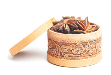 Wall Mural - Anise in a wooden box Dried star anise spice fruits