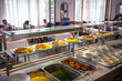© Dragan - Students being served meal in school canteen. Lunch break. Education people and students eating food meals school cafeteria. Belgrade, Serbia 17.05.2022
