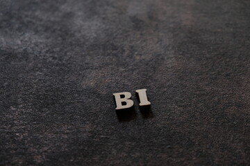 Wall Mural - the letters b and i above the dark field. initials bi