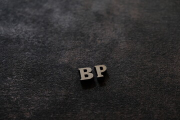 Wall Mural - the letters b and p above the dark field. initials bp