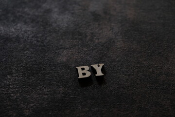Wall Mural - the letters b and y above the dark field. initials by