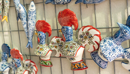 Wall Mural - Barcelos Rooster or Galo de Barcelos on display at a souvenir shop, local handicrafts from Portugal.