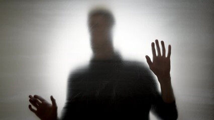 Blurred man looking for a way out. The concept of loneliness, mental health, depression.