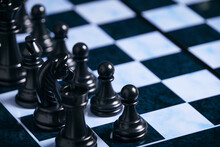Black Chess Pieces On A Chessboard.