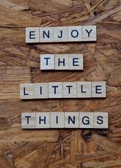 enjoy the little things text on wooden square, motivation and inspiration quotes