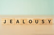 嫉妬・ジェラシーのイメージ｜「JEALOUSY」と書かれたブロック
