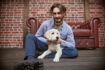 Poster - guy playing with puppy