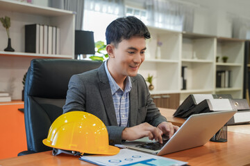 Poster - Portrait professional engineer smiles and looks in computers working with communication internet design project modern looking lifestyle background