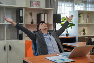 Poster - Relaxed person businessman portrait smiling In Chair After Online Work in office work using laptop professional on desk modern workplace network digital executive cyberspace communication