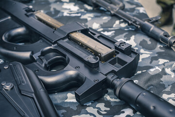 Automatic weapons on a table for a close-up demonstration