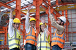 © BritCats Studio - Asian people group of multi mix race worker with supervisor holding hand to cheer up and encourage before working at industrial factory site. Teamwork, labor brainstorm or group working concept.