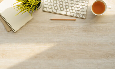 Fototapete - Flat lay of top view desk work table with Coffee computer notebook and pencil work space in minimal wood warm tone concept includes copyspace for add text or graphic