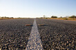 © Austockphoto - White line and cats-eye reflectors on an outback highway