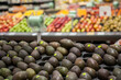 © Austockphoto - Ripe black avocados for sale in the grocery store