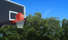 Ball For Basketball And Basketball Hoop On White Background. Hitting The Ball In The Basket