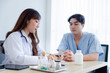 © Danai - Professional asian female doctor interacting medical consulting with patient, Male patient get advice about medicine from doctor at hospital
