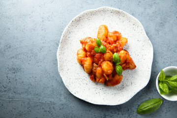 Baked potato gnocchi with tomato sauce and basil