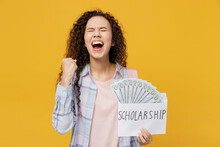 Young Black Teen Girl Student She Wear Casual Clothes Backpack Bag Hold Fan Cash Money In Dollar Banknotes Do Winner Gesture Isolated On Plain Yellow Background High School University College Concept.