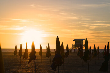 Poster - Sunset behind the parasols of Deauville in Normandy
