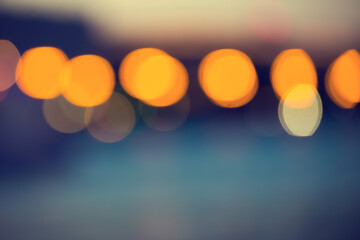 Poster - Blurred abstract urban background with street lights in bokeh shape